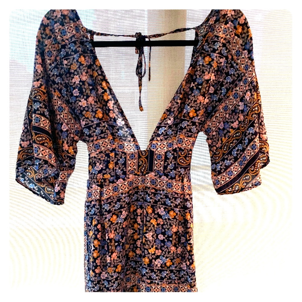 DEEP V open back floral romper!